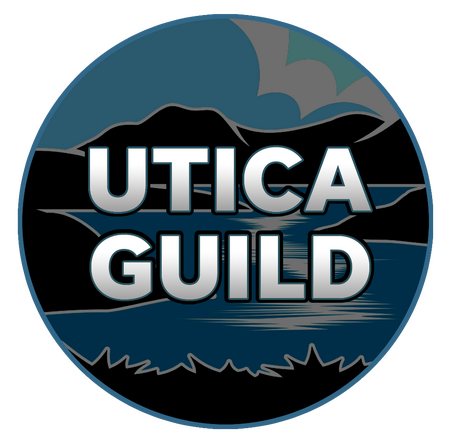 An badge bearing an image of a river sitting in a valley between mountains. Across it in white text is the phrase "UTICA GUILD."